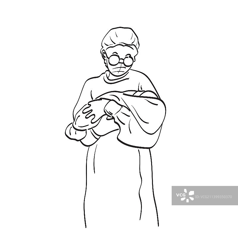 戴着医用口罩的护士抱着新生婴儿图片素材