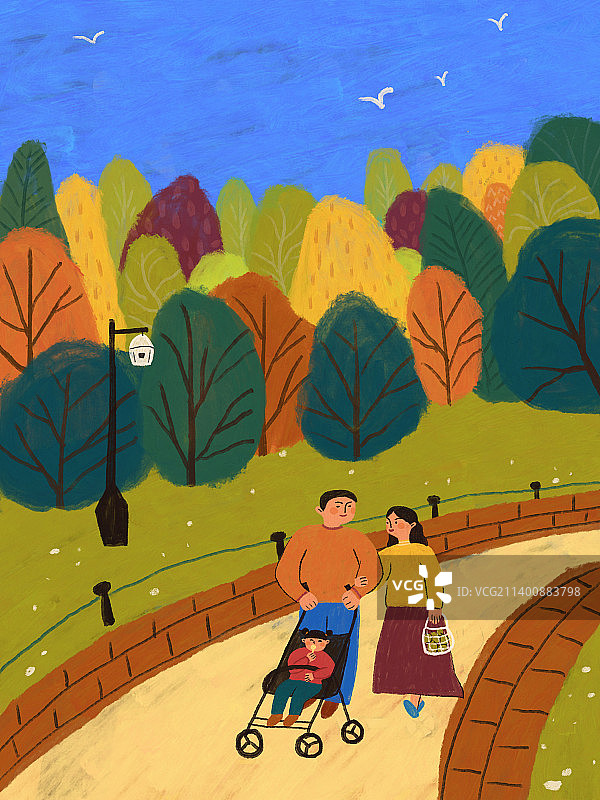 秋天爸爸妈妈推着可爱的宝宝散步在秋景中图片素材