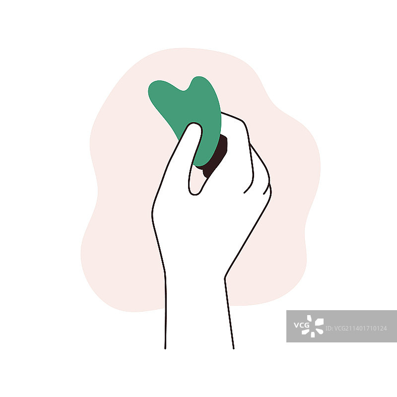 手持刮痧按摩的刮痧玉石板图片素材