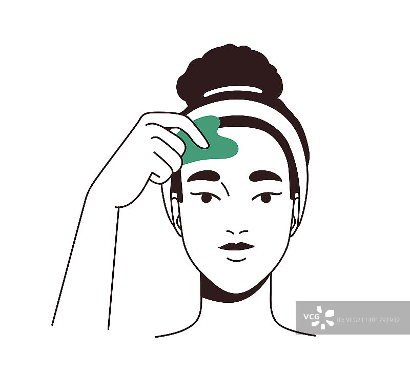 女子用刮痧玉按摩面部肌肤图片素材