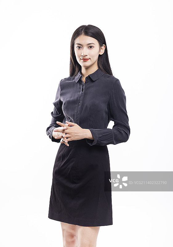 白色背景下穿着黑色衬衫短裙的商务女性图片素材