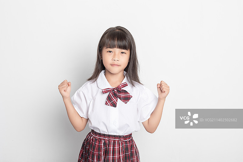 一个天真可爱的中国小学生图片素材