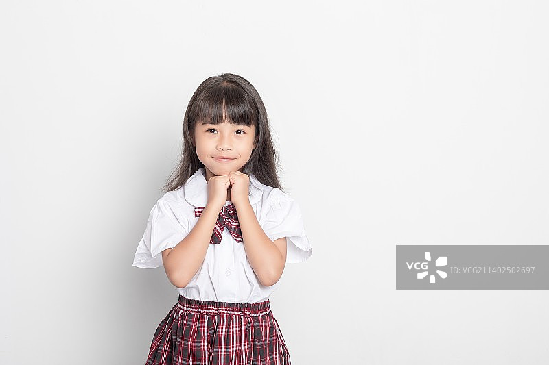 一个天真可爱的中国小学生图片素材