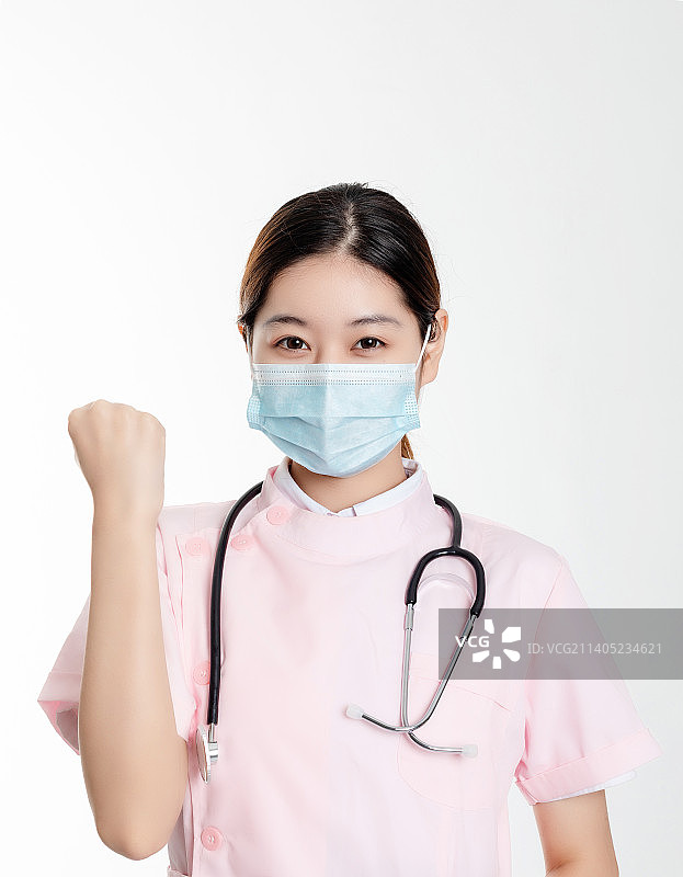 医疗主题白色背景中一位年轻护士图片素材