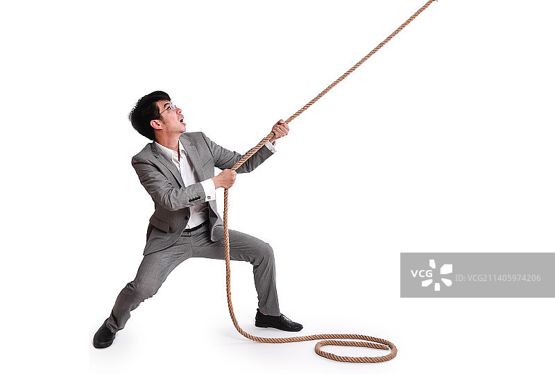 拉绳子的男性商务人士图片素材