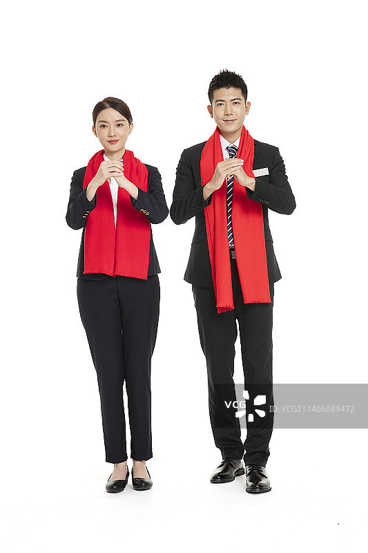 身着职业装的年轻男女拜年图片素材