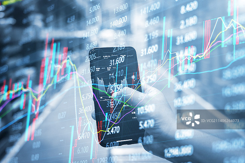 投资者用手机进行股票交易和金融股市走势背景图片素材