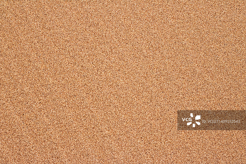 夏季沙滩上的沙子，纹理背景图片素材