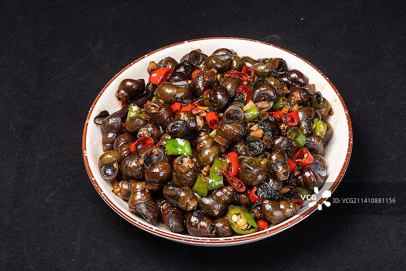 辣椒炒田螺，餐饮小吃嗦螺，青红椒炒螺蛳图片素材