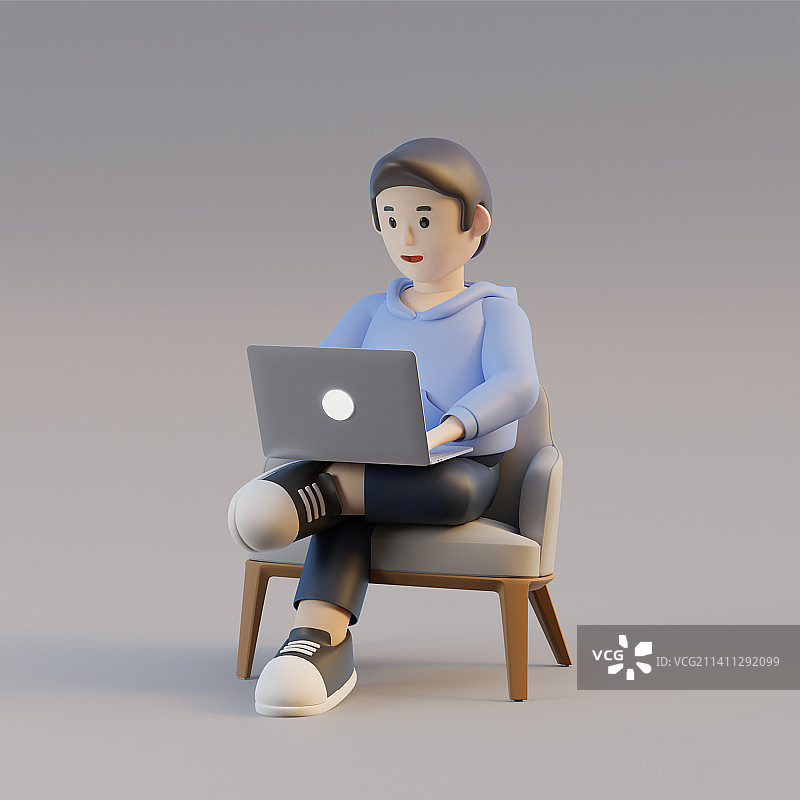 坐在椅子上用笔记本电脑的男孩图片素材
