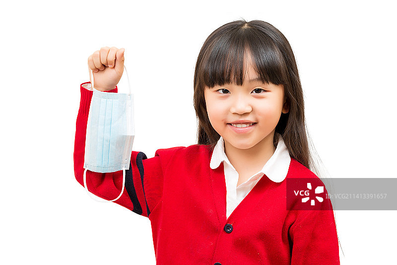 白色背景前单手拿掉口罩的小女孩图片素材