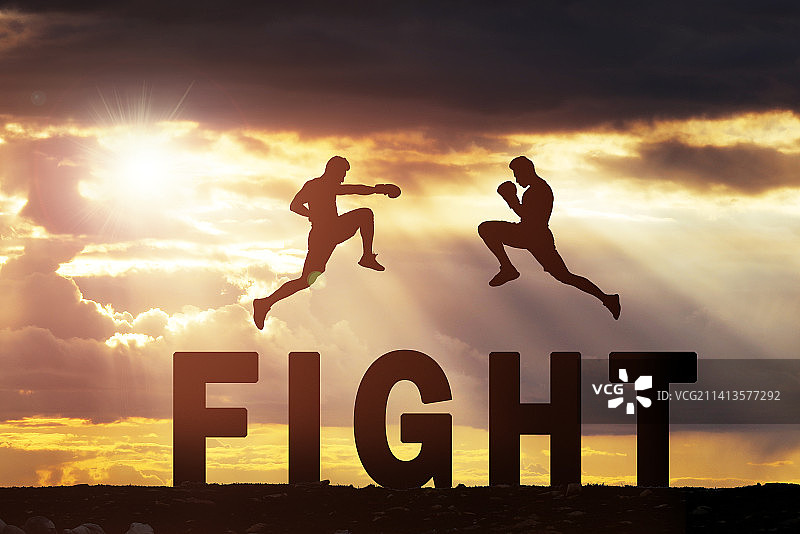 两个青年人腾空而起剪影,字母FIGHT,对决竞争概念图片素材
