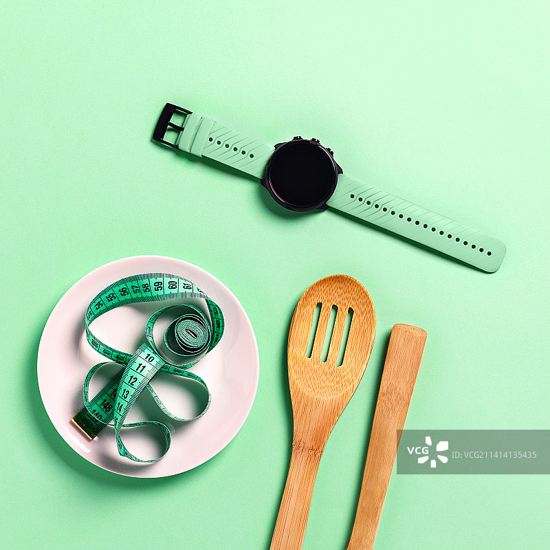 饮食运动概念，盘子上的卷尺，美国图片素材