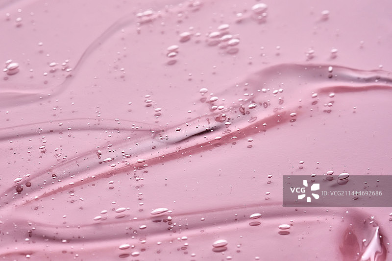 粉色背景上的化妆凝胶质地图片素材