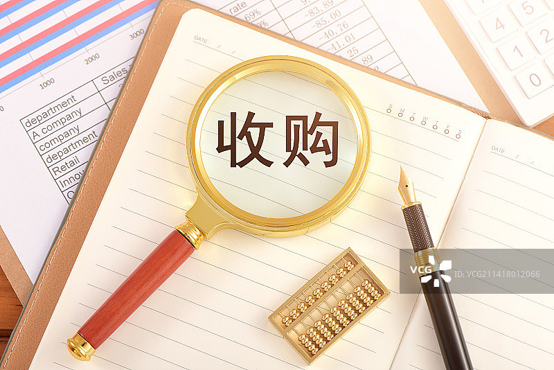 图表上的放大镜印着文字收购图片素材