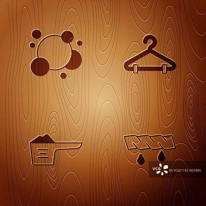 挤压衣物、肥皂、水和气泡的洗衣套装图片素材