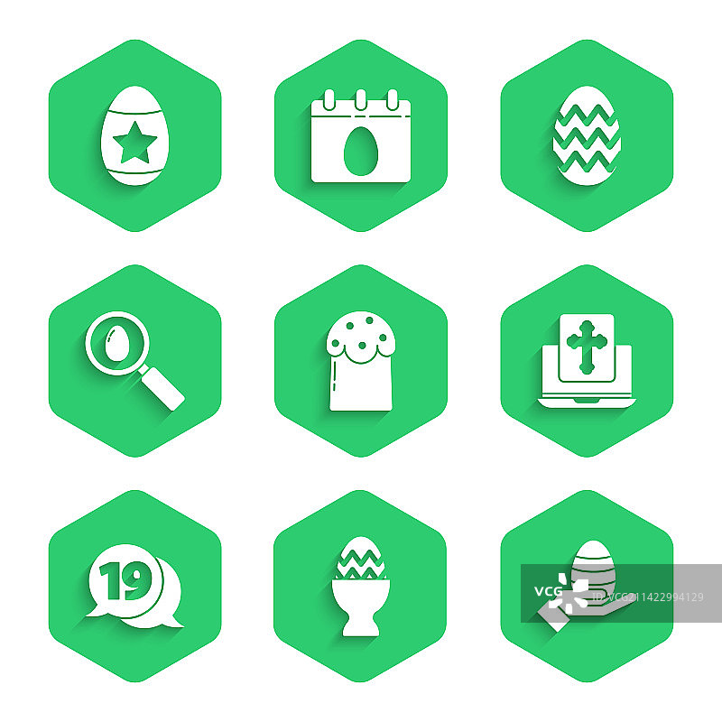 复活节蛋糕、蛋架上的彩蛋和人手图片素材