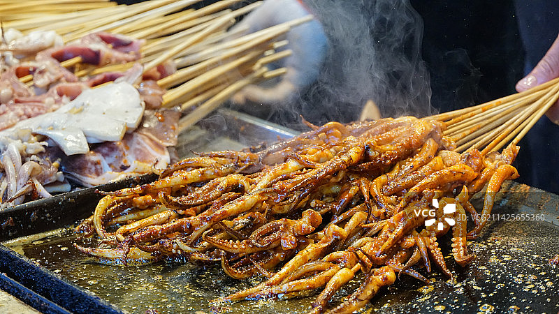 夜市美食特色小吃铁板鱿鱼图片素材