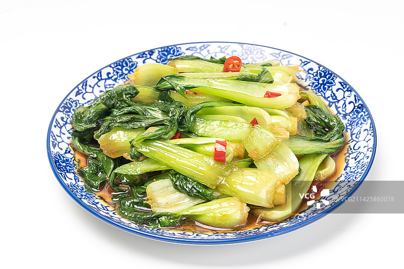 白色背景盘子里的素炒上海青蔬菜图片素材