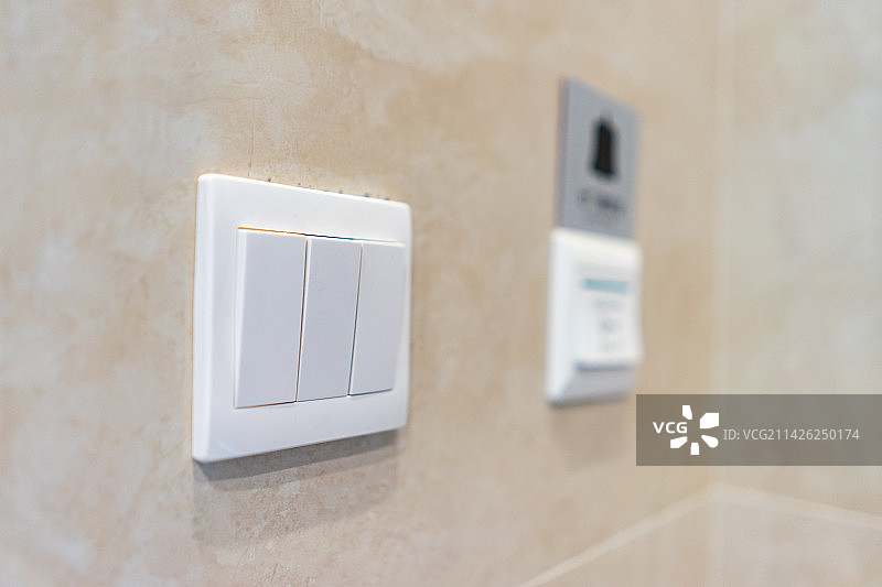 中国房地产城市健康生活拍摄主题，住宅内部环境，起居室里的墙壁上的家电开关，室内无人图像摄影图片素材