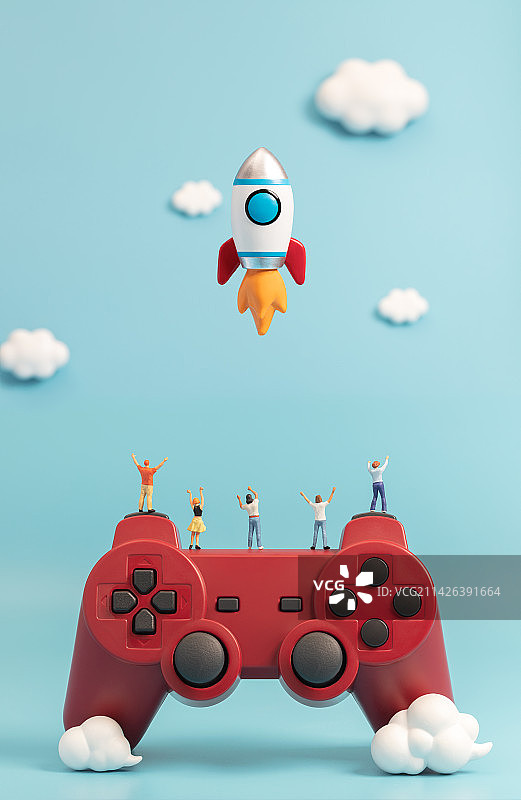 微缩创意站在游戏手柄上看火箭起飞的人群图片素材