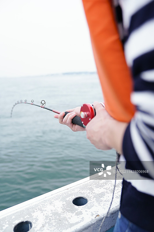 手持鱼竿图片素材