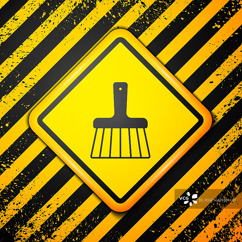 黄色背景上的黑色扫帚图标图片素材
