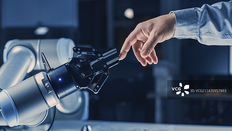 机器人手臂触摸人手图片素材
