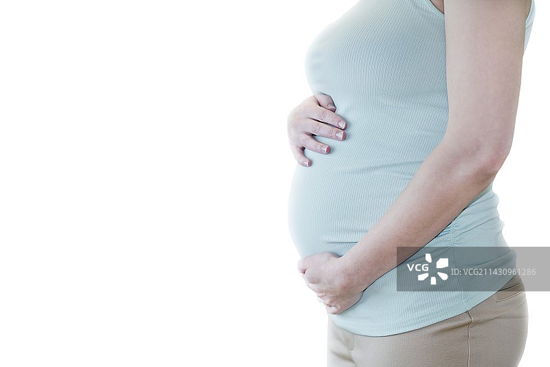 双手放在腹部的孕妇图片素材