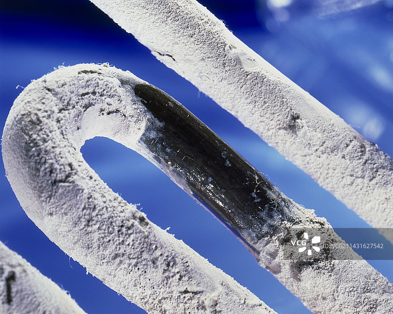 洗衣机加热元件上的水垢图片素材