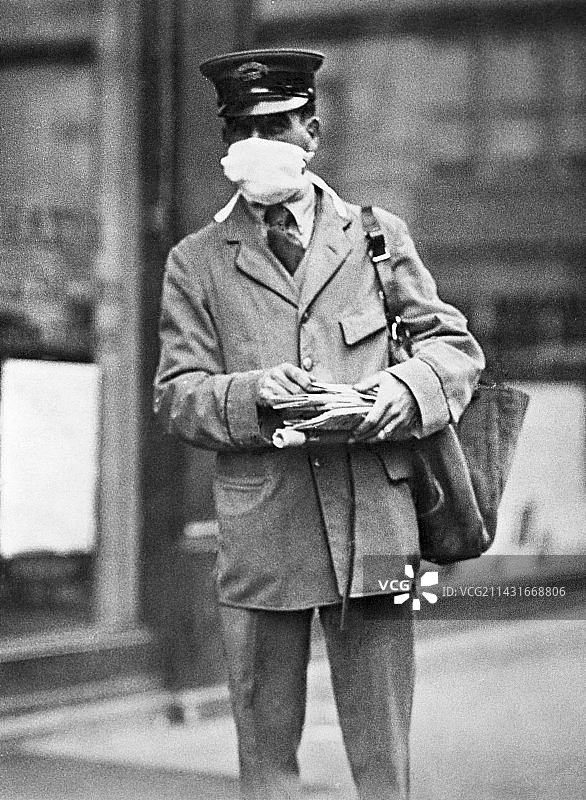 戴着口罩的邮递员，美国，1918年图片素材