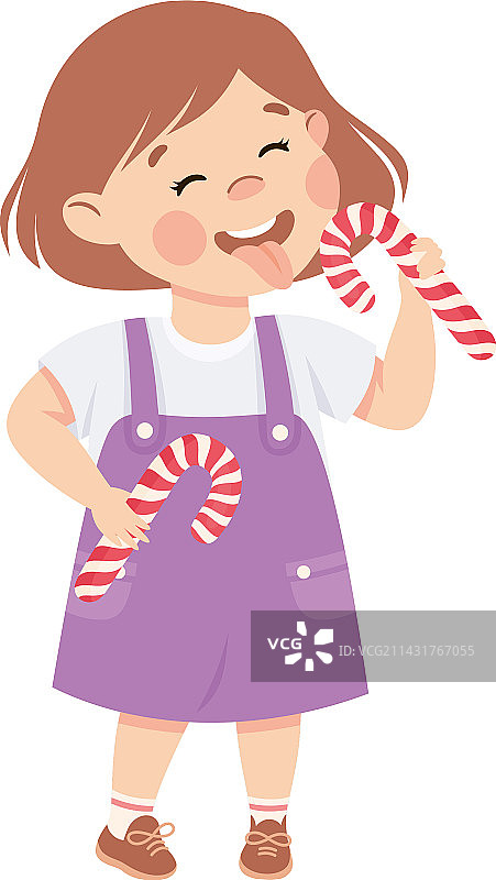 快乐地吃甜拐杖糖的小女孩图片素材