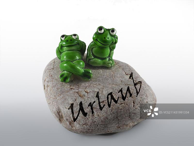 石头上的青蛙雕像，德语意为假期图片素材