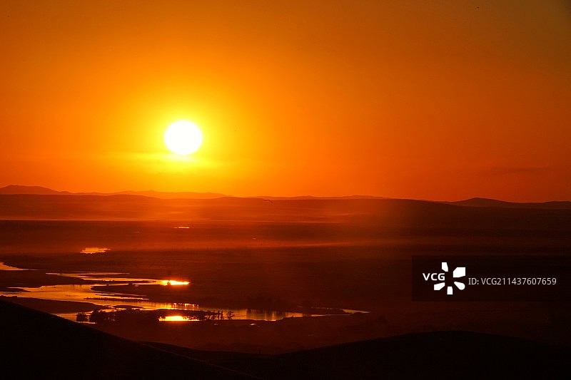 呼伦贝尔黑山头日落的美景图片素材