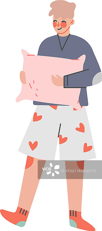 穿着舒适家居服、抱着枕头的青少年男孩图片素材