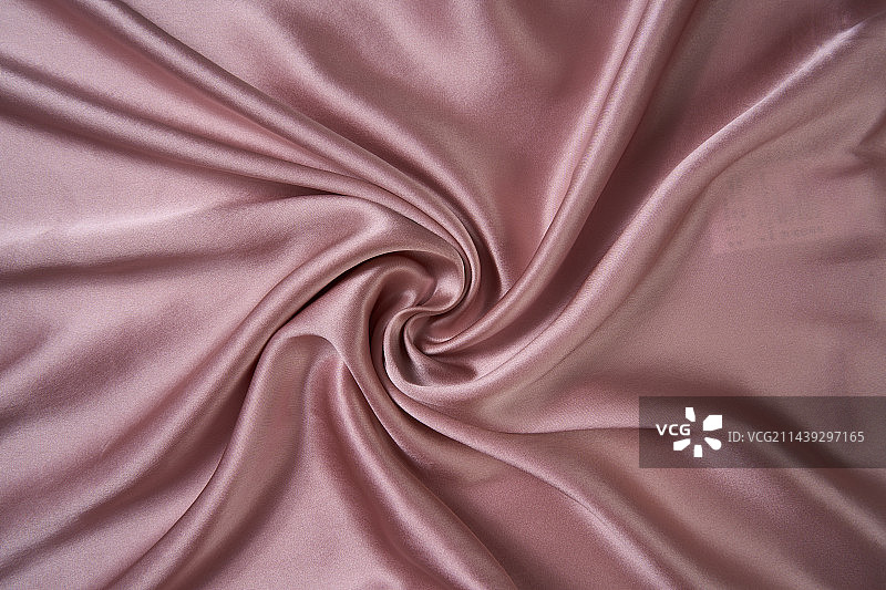 亮粉色的丝绸扭曲特写图片素材