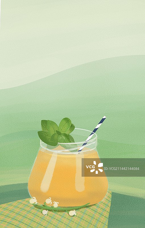 绿色平原前一大杯橙色饮品图片素材