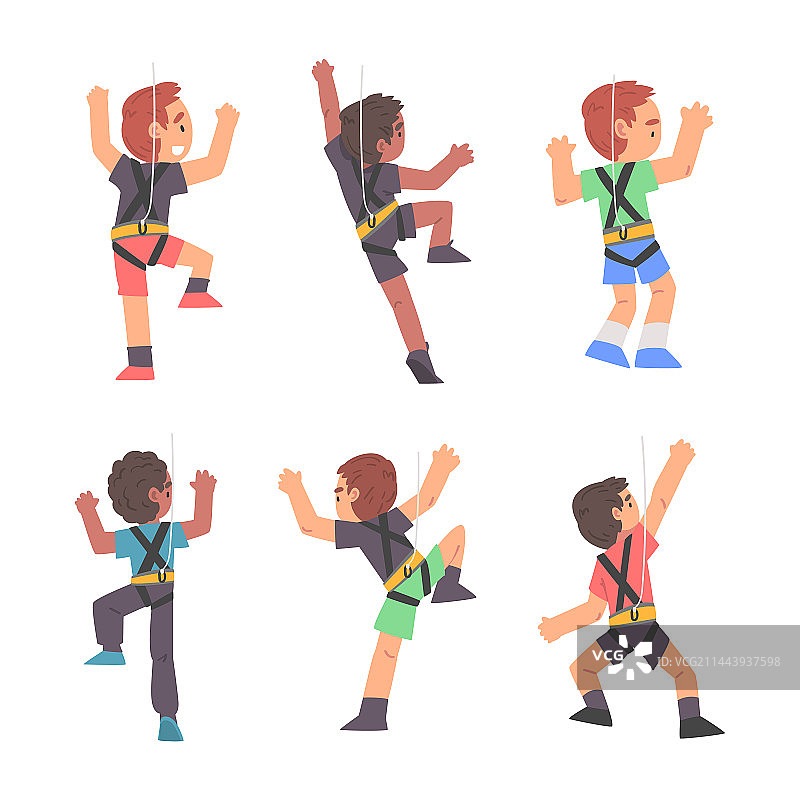 小男孩攀登陡峭的岩石或墙壁图片素材