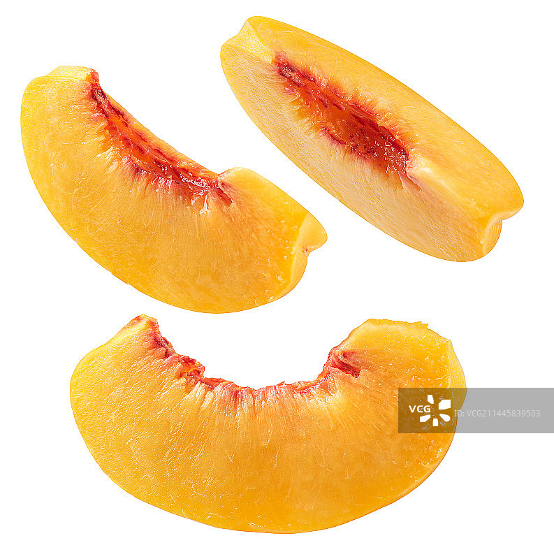 白底上的新鲜黄桃特写图片素材