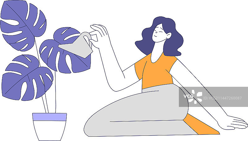 快乐的女人给植物浇水图片素材