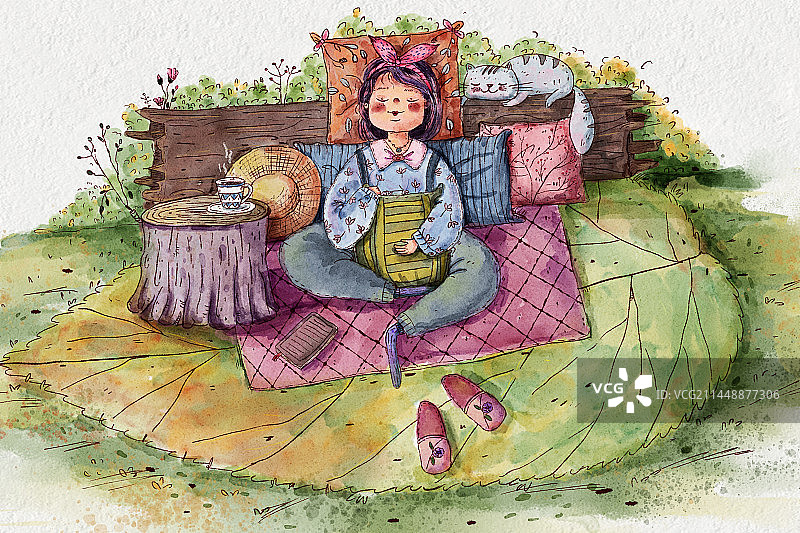 坐在草地上的年轻女子图片素材