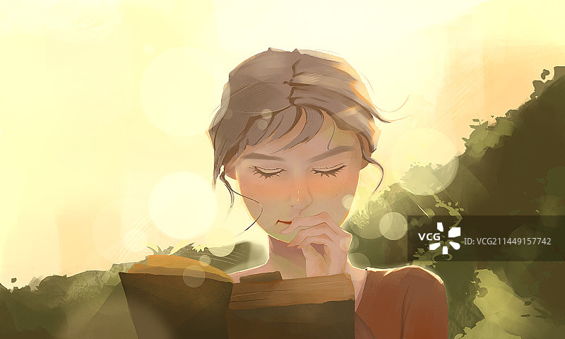 金黄的阳光下看书阅读的女孩图片素材