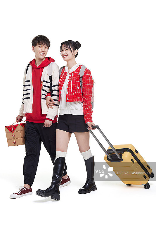 快乐的年轻夫妇回家庆祝中国新年图片素材