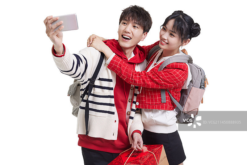 Young couple taking selfie with smart phone图片素材