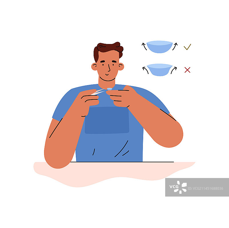 男人用镊子把隐形眼镜戴在手指上图片素材