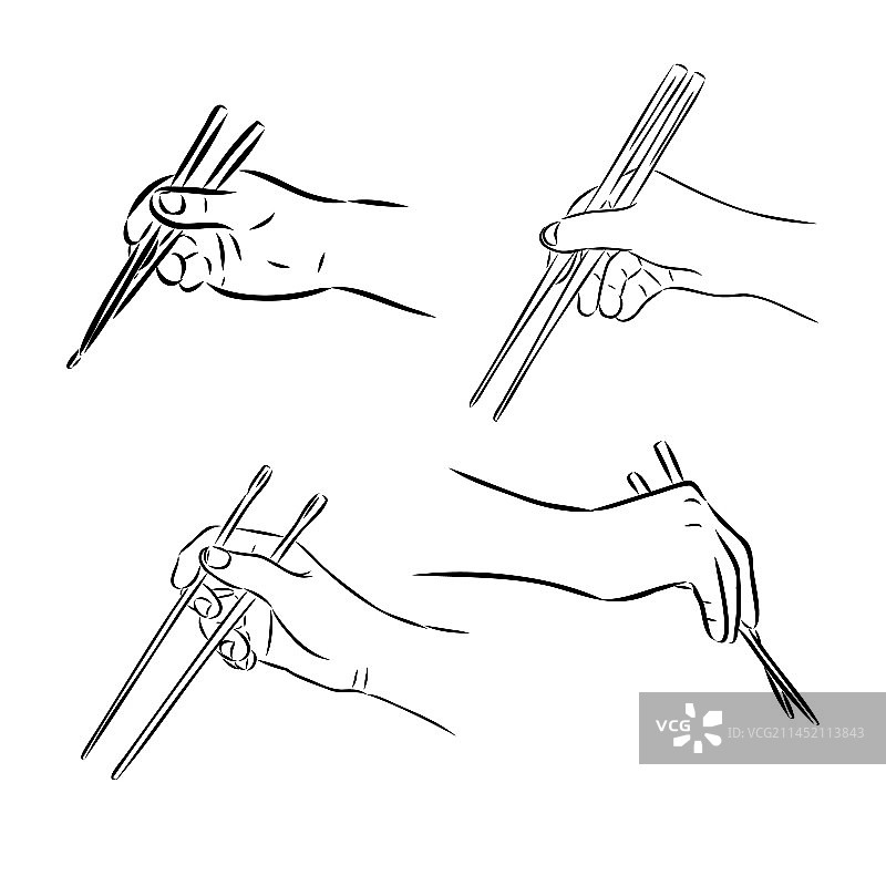 在白色背景上使用竹筷的手图片素材
