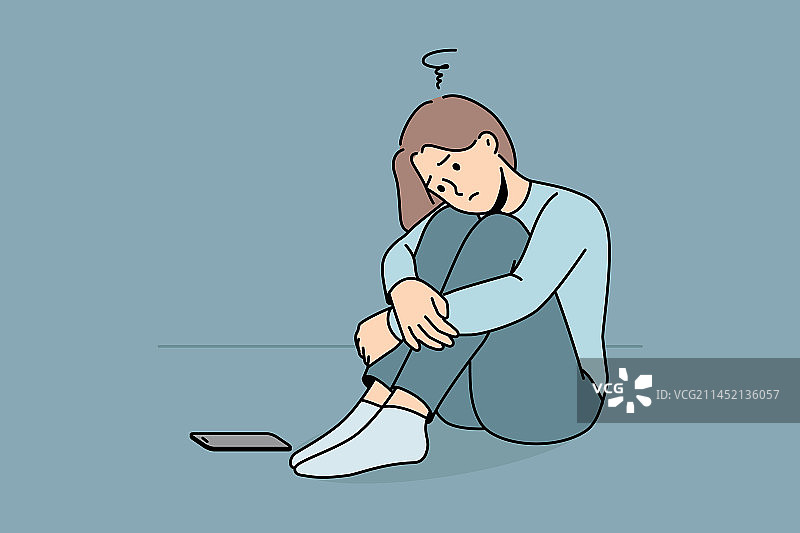 悲伤的女人坐在那里等待电话图片素材