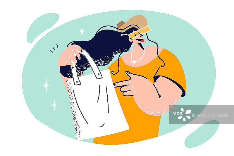 女人手提可重复使用的购物袋去超市图片素材