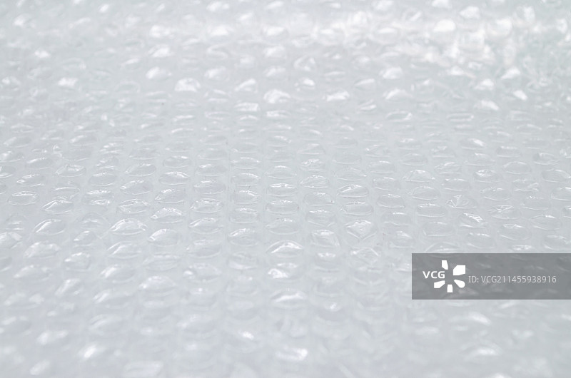 亚洲中国手包裹用品拍摄主题，内室内影棚拍摄静物图像，一个透明的气泡垫，室内无人图像摄影图片素材