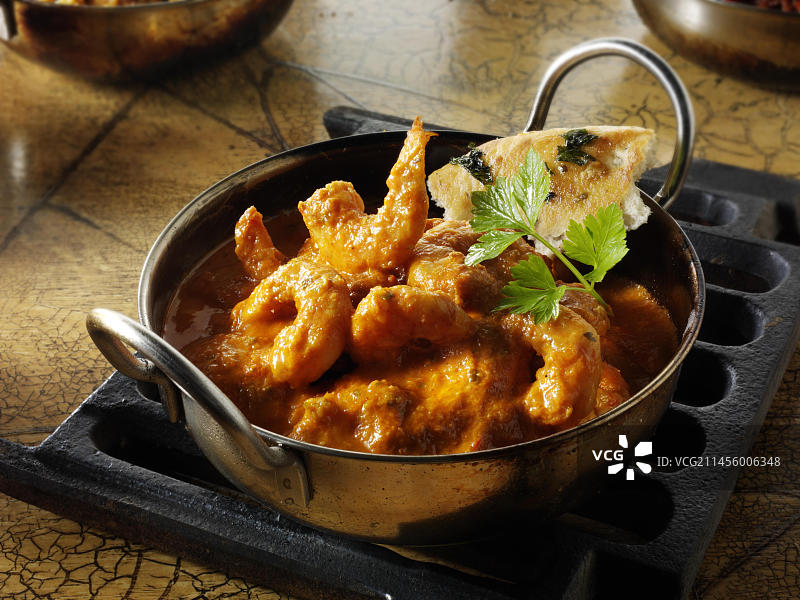 印度玛克哈尼咖喱虾配米饭图片素材